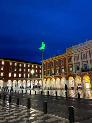a street light in front of buildings at night at 