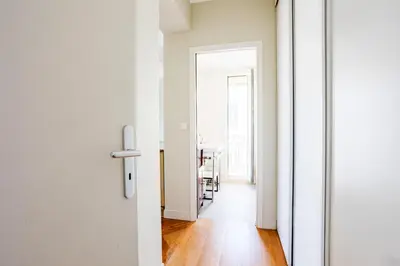 a hallway with a door leading to a dining room at LUNG ARNO AP4300 By Riviera Holiday Homes in Nice