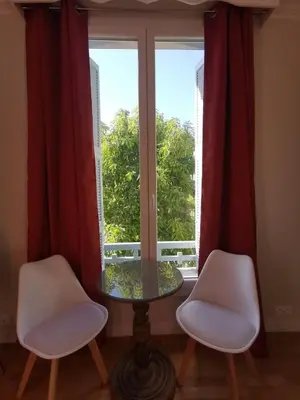 a table and two chairs in front of a window at Chambre privée luxueuse Villa Monte 0ropa in Nice