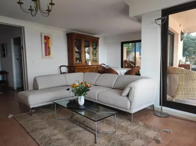 a living room with a white couch and a table at Nice Absea Corniche Fleurie in Nice