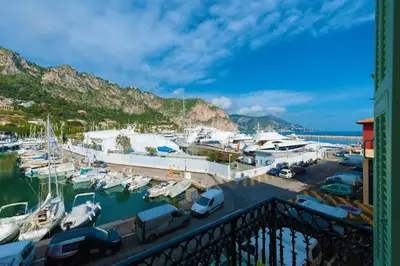 a marina with many boats in the water at Stunning Beaulieu Sur mer Retreat Chic with Air-Conditioning and Breathtaking Views in Beaulieu-sur-Mer
