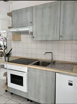 a kitchen with a sink and a stove at Nice Studio With View Near Beach in Nice