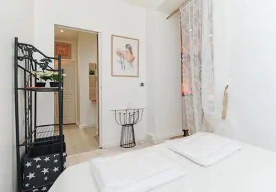 a bedroom with a bed and a window at PV STUDIO Five Stars Holiday House in Nice