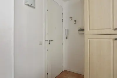 a hallway with a closet and a door in a room at Appartement Lamartinesque - Welkeys in Nice