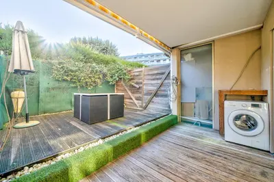 a balcony with a washing machine on a deck at Charmant studio in Cagnes-sur-Mer