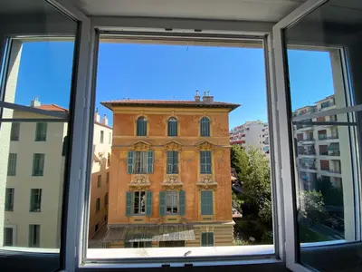 a view of a building from a window at Charmant 2 pièces - hypercentre, proche mer in Nice