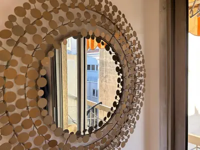 a mirror on a wall with a window at Nice la Belle, city centre 1 bed, 2 terrace, quiet in Nice