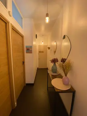 a living room with a couch and a view of the ocean at Appartement Nice Promenade in Nice