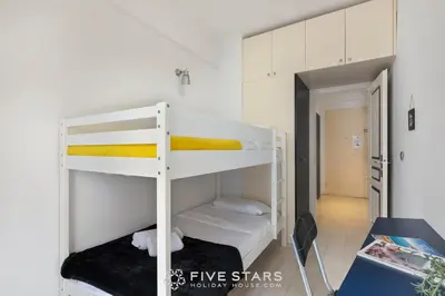 a small room with two bunk beds in it at Suite Reine Marie FSHH in Nice