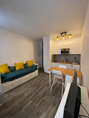 a small living room with a couch and a table at Vieille ville in Nice