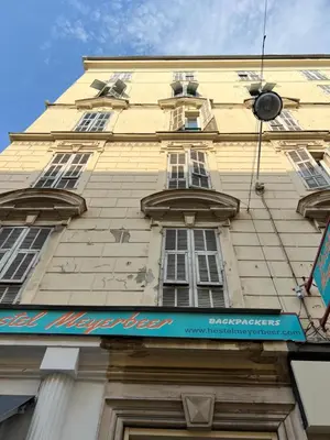 a tall building with a sign on the side of it at NICE - Central 100m plage- Negresco - IDEAL COUPLE in Nice