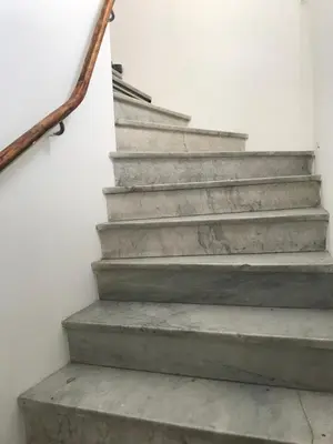 a set of concrete stairs with a metal rail at Villa Niçoise.3P. 5 min de la plage in Nice