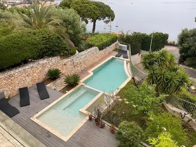 an overhead view of a swimming pool in a garden at Villa LA ALEGRIA in Nice