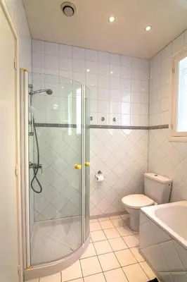a bathroom with a shower and a toilet and a sink at Villa Soleil d'Or in Villefranche-sur-Mer