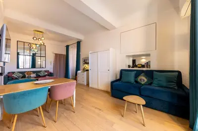 a clock tower in the middle of a city street at 06A3 - Lovely apartment in the heart of old Nice in Nice