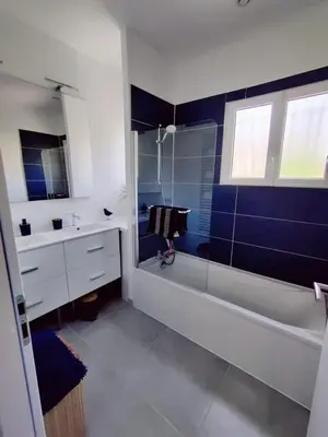 a bathroom with a shower and a tub and a sink at La Villa Castel - Haut de villa - parkings- 3 chambres - 8 couchages - jardin - barbecue in Cagnes-sur-Mer