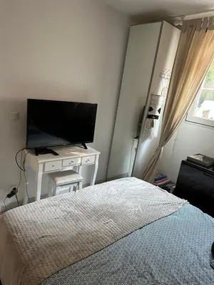 a bedroom with a bed and a flat screen tv at Ninon in Nice