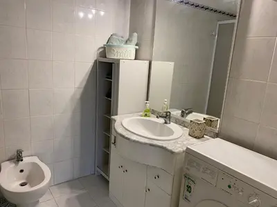 a bathroom with a sink and a toilet at Coquet logement front de mer in Cagnes-sur-Mer