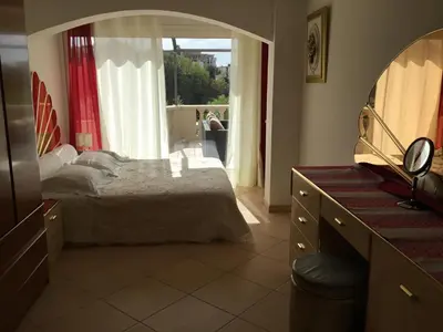 a bedroom with a bed and a large mirror at Villa Paradiso, logement avec piscine, Nice Nord in Nice