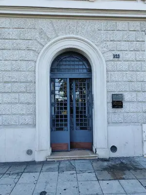an entrance to a brick building with a door at LE 323 PROM - BEACHFRONT - PARKING - NEAR TRAM &SUPERMARKET - AC - washing machine in Nice