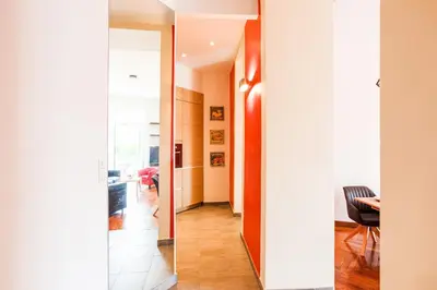 a hallway with a door leading to a living room at MASSENA AP4312 By Riviera Holiday Homes in Nice