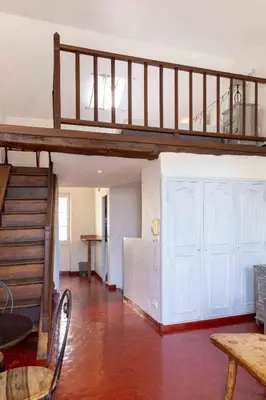 a living room with a loft bed and a staircase at Appartements Vivo in Cagnes-sur-Mer