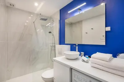 a bathroom with a white sink and a shower at BLUE LIGHT TERRACE - Nice Port in Nice