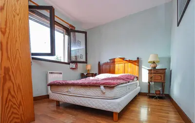 a bedroom with a bed and a window at Nice Home In Saint-Jeannet in Saint-Jeannet