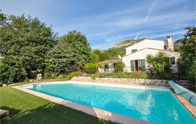a swimming pool in the yard of a house at Nice Home In Saint-Jeannet in Saint-Jeannet