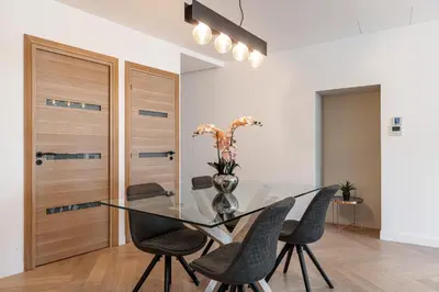 a dining room with a glass table and chairs at Magnifique appartement, Nice Centre Ville - Masséna in Nice