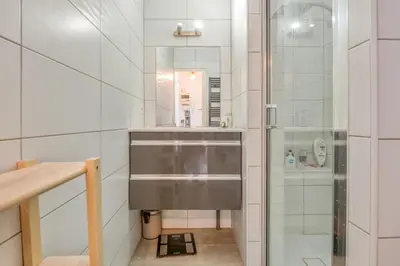 a bathroom with a sink and a shower at Appartement Rivage - Welkeys in Cagnes-sur-Mer