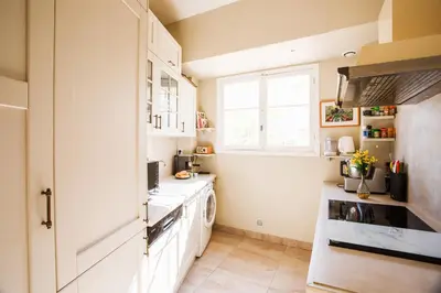 a small kitchen with a sink and a stove at Imperial AP4318 by Riviera Holiday Homes in Nice