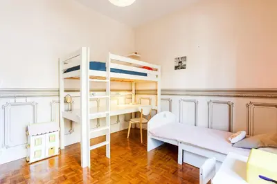 a room with a bunk bed and a desk at Imperial AP4318 by Riviera Holiday Homes in Nice