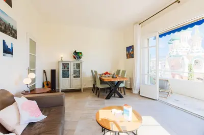 a living room with a couch and a table at Imperial AP4318 by Riviera Holiday Homes in Nice