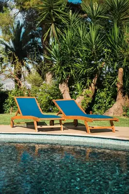 two lounge chairs sitting next to a swimming pool at Charming Villa Saint-Jean-Cap-Ferrat in Saint-Jean-Cap-Ferrat