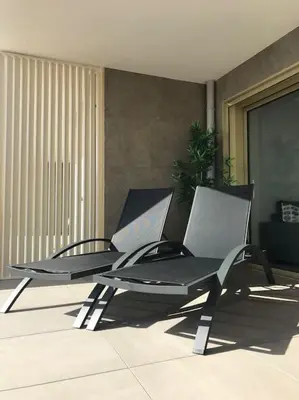 a chair sitting on top of a patio at Blue Pearl A008 By Avecoeur in Nice