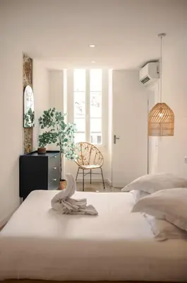 a bedroom with a bed with a towel on it at A/C & BALNEO in of Carré d'Or NICE #RENOVATED in Nice