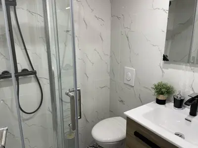 a bathroom with a shower and a toilet and a sink at Apart Nissa Bella Massena / Vieux Nice in Nice