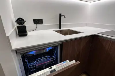 a kitchen with a dishwasher with a sink and a sink at OPERA PROMENADE 2 Renovated 1 min to Beach Air Conditioning in Nice