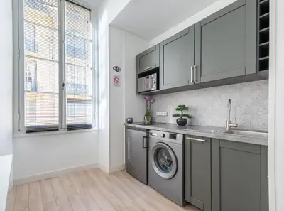 a kitchen with a washing machine and a sink at Studio Famous bd Victor Hugo - city center in Nice