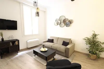 a living room with a couch and a tv at 06R - Nice modern apartment - Vieux Nice in Nice