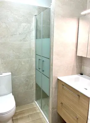 a bathroom with a shower and a toilet and a sink at Residence le Florence in Nice