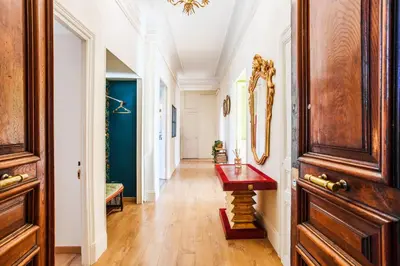 a hallway with a red table in a room at LE PALAZZO AP4329 By Riviera Holiday Homes in Nice