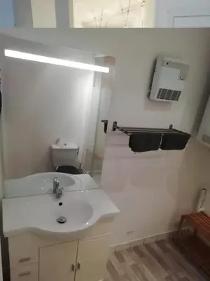 a white bathroom with a sink and a toilet at Romantique - NeaSpace Vieux Nice in Nice