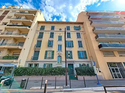 a large apartment building on the side of a street at Nestor&Jeeves - GOLDIE FRANCE RIVIERA - Very close sea in Nice