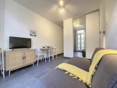 a living room with a bed and a tv at Nestor&Jeeves - GOLDIE FRANCE RIVIERA - Very close sea in Nice