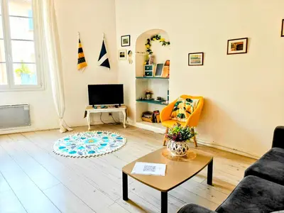 a living room with a couch and a table at St Joseph · Great holiday flat - old town for 4 in Nice
