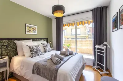 a bedroom with a bed with pillows and a window at #4 Papon Parking climatisé terrasse & wifi 5mins à pieds du Vieux Nice in Nice