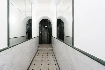 a corridor with a door in a building at Jolie studio - Proche Promenade des anglais in Nice