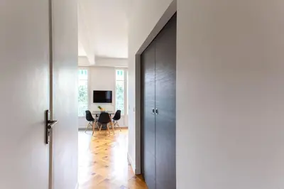 a hallway with a door leading to a dining room at #7 What else ? Your own quiet terrace in Nice center 10min to Beach in Nice